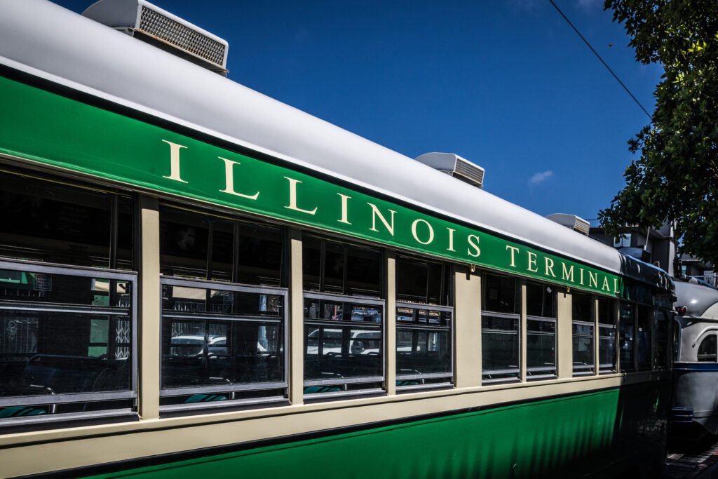Historic green and cream Illinois Terminal streetcar parked at Fishermans Wharf in San Francisco California USA.