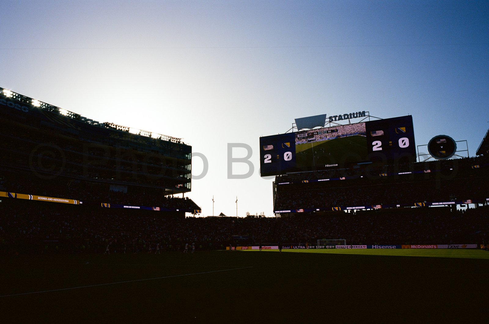 A silhouetted view of the scoreboard during a football game. A silhouetted view of the scoreboard during a football game.